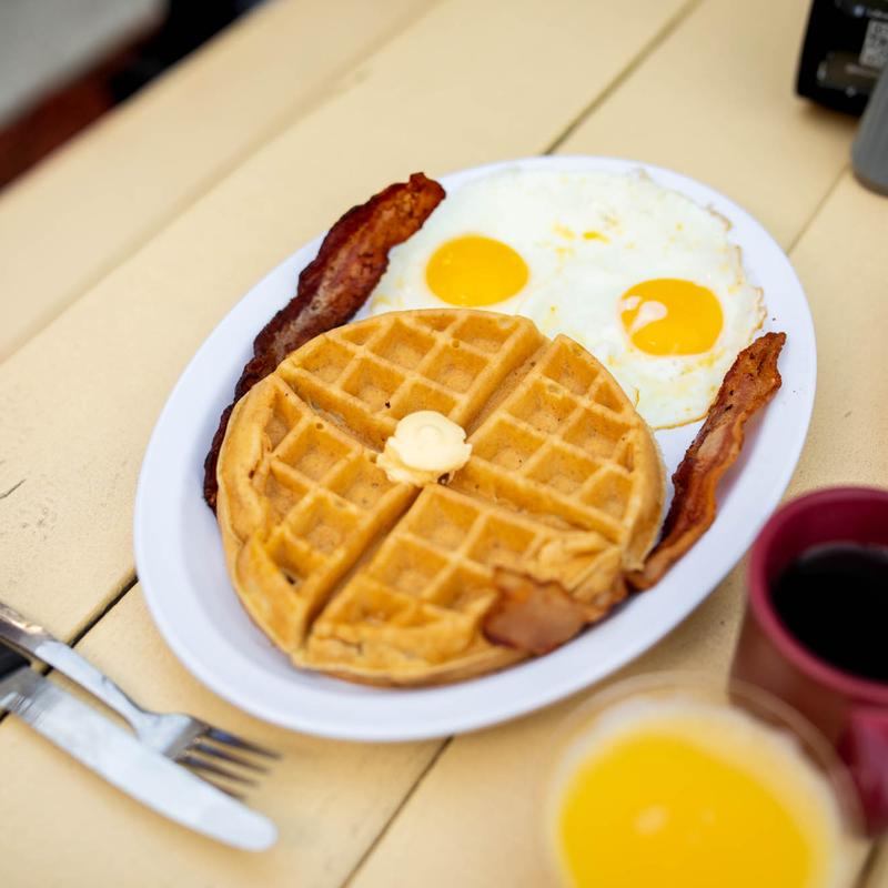 Breakfast menu for southern grill featuring waffles, bacon and eggs