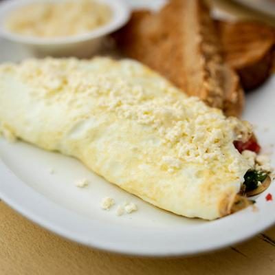 loaded omelet with toast breakfast